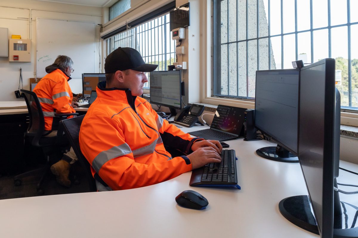 Men working at computers