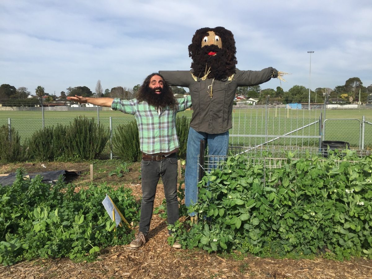 Costa Georgiadis with a scarecrow depicting him.