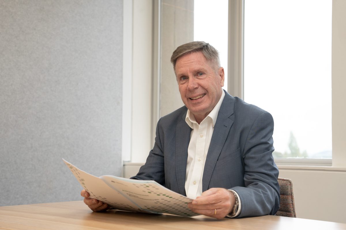 man in suit reading a report