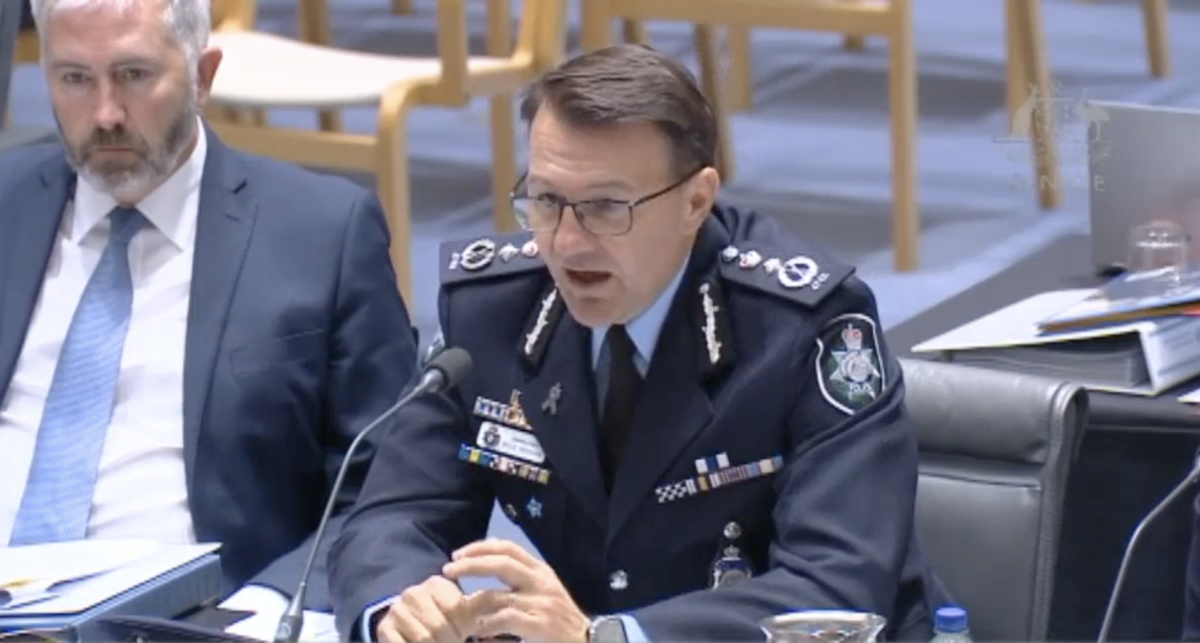 high-ranking policeman speaking at government inquiry