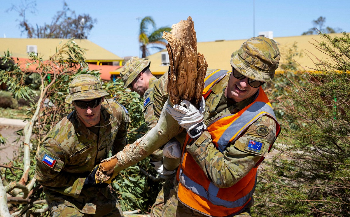 ADF personnel clear trees
