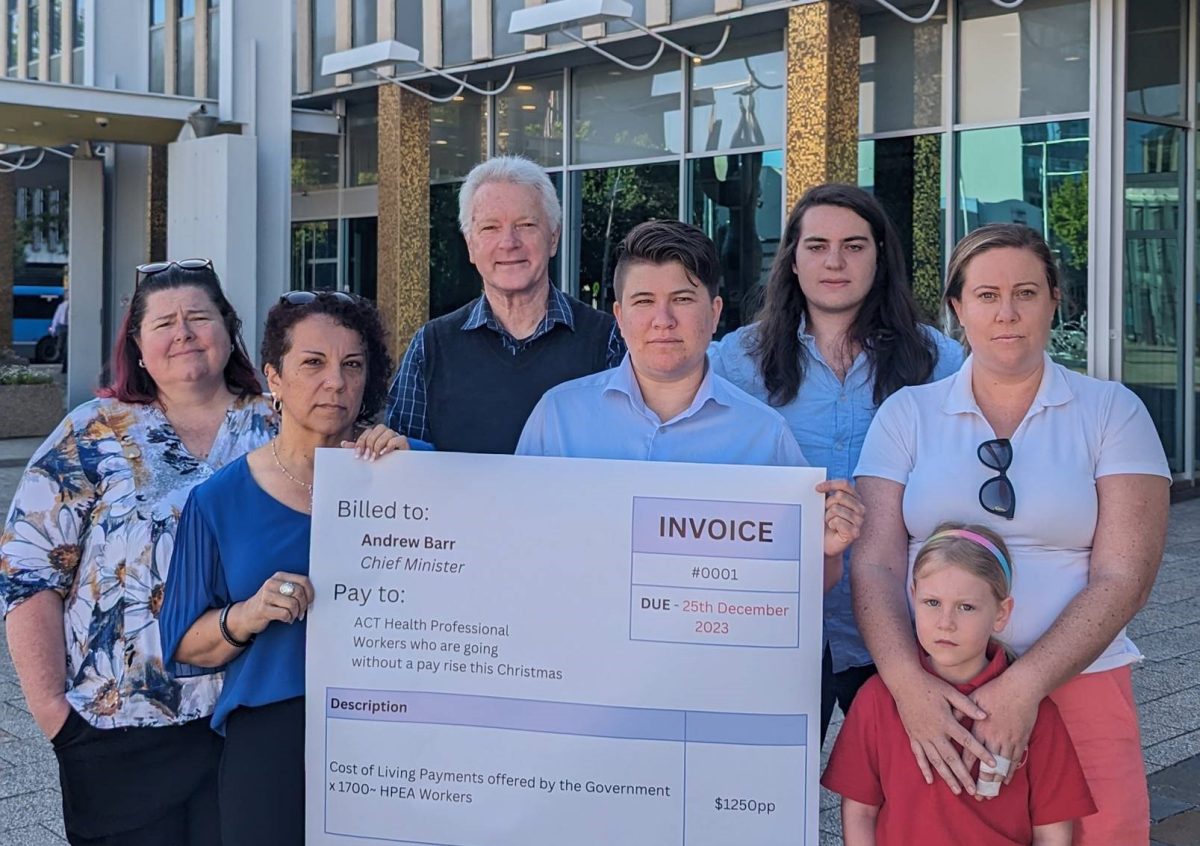 ACT Health workers present oversized invoice