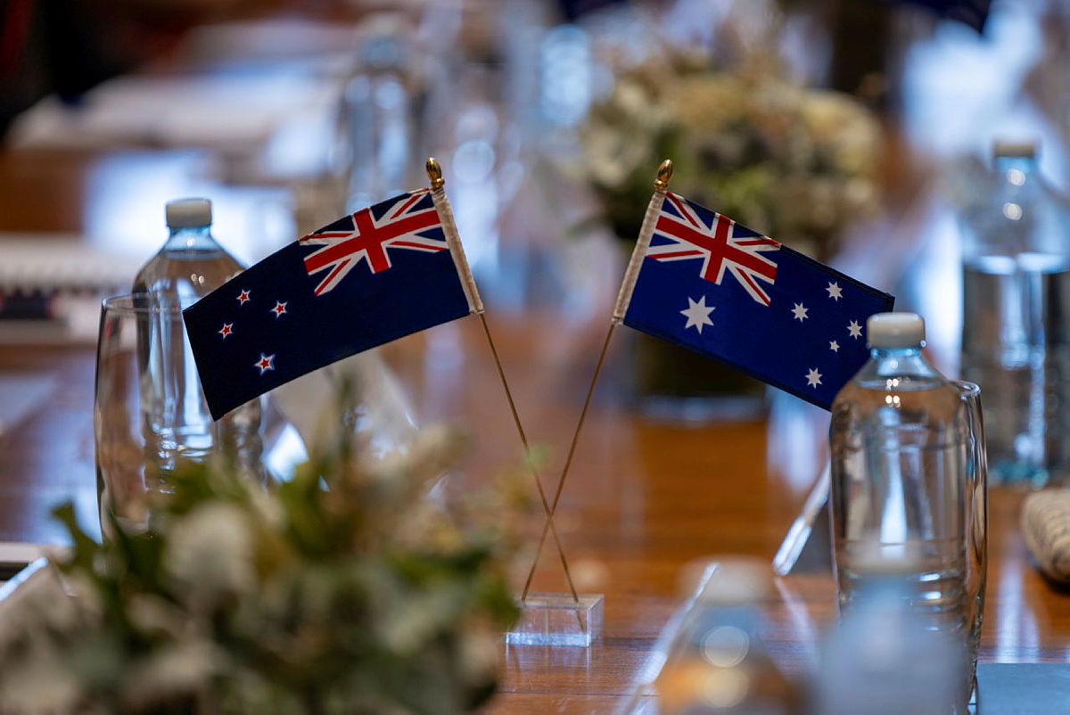 small Australian and New Zealand flags on a table
