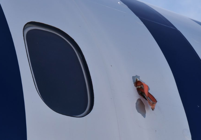 propeller strap in plane wall, external shot