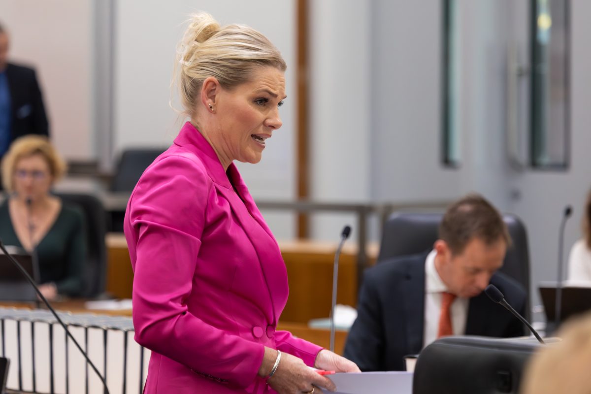 Woman speaking into microphone