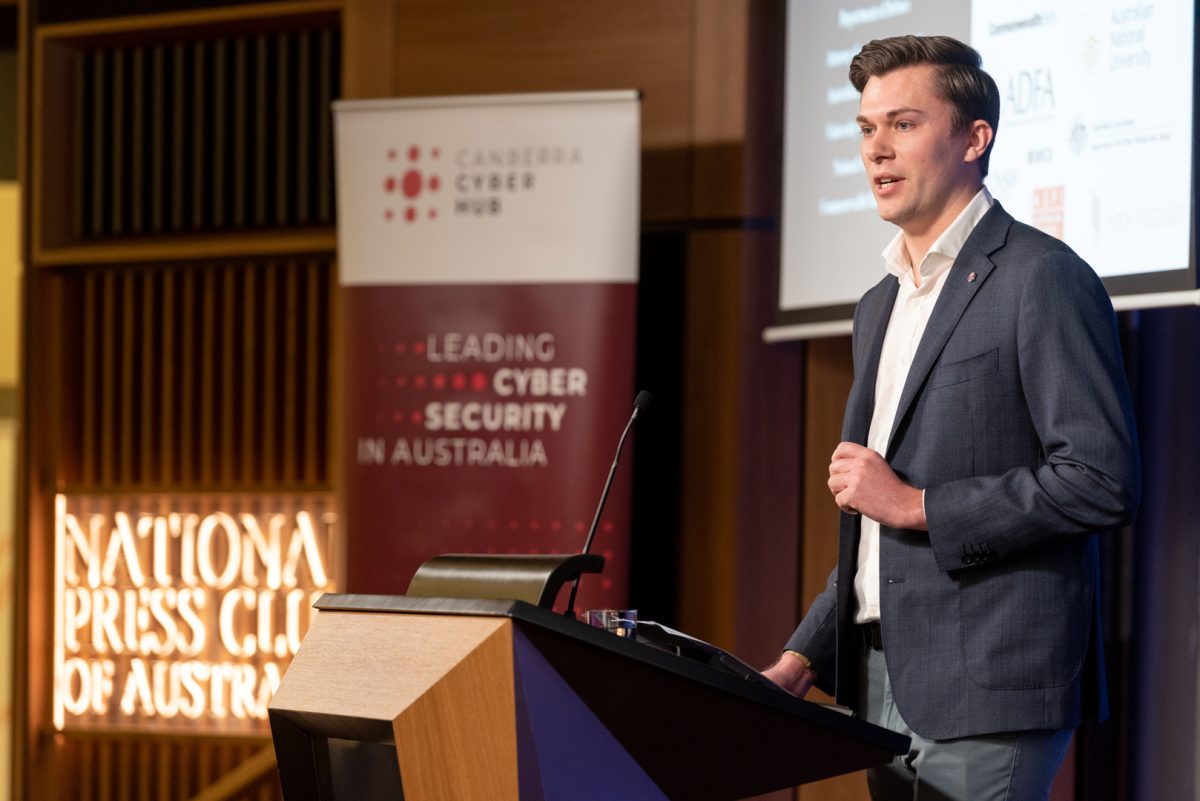 man standing behind a lectern