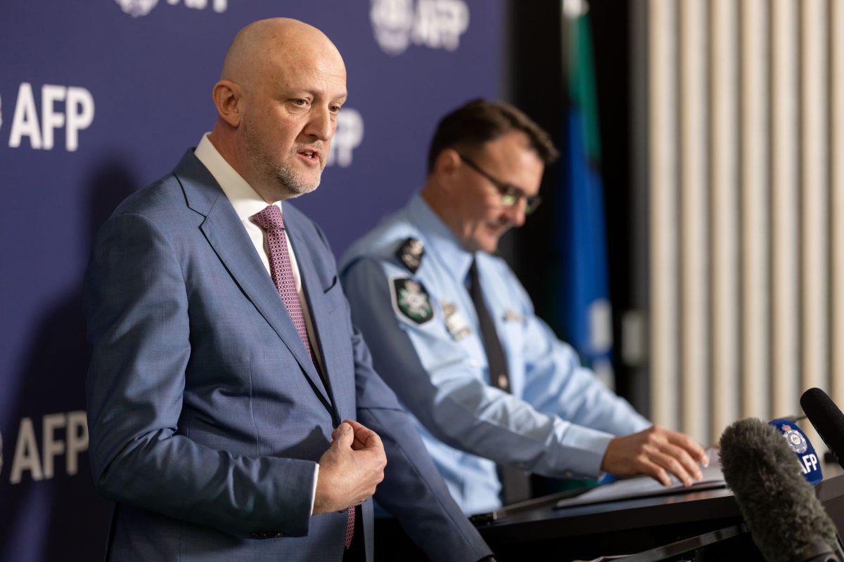 two men at media conference