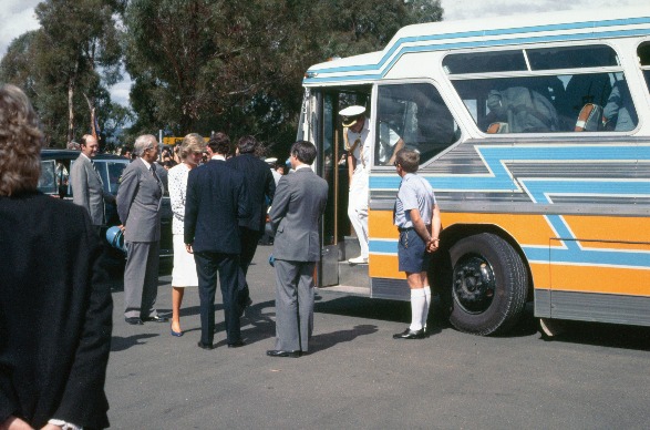 Prince Charles getting off a bus