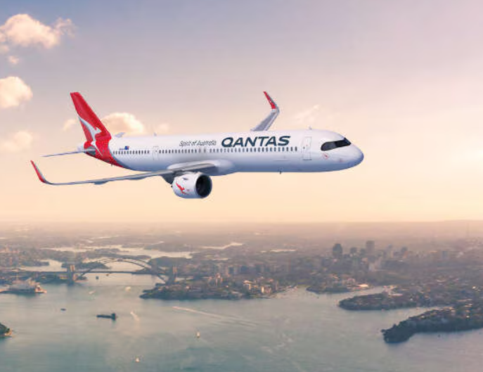 Qantas plane flies over Sydney Harbour.