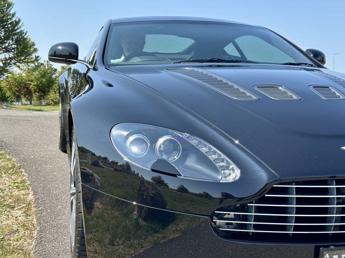 Close-up of a black sports car's headlight