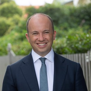 smiling man in a suit