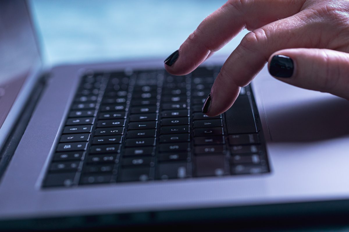 Hand on laptop computer