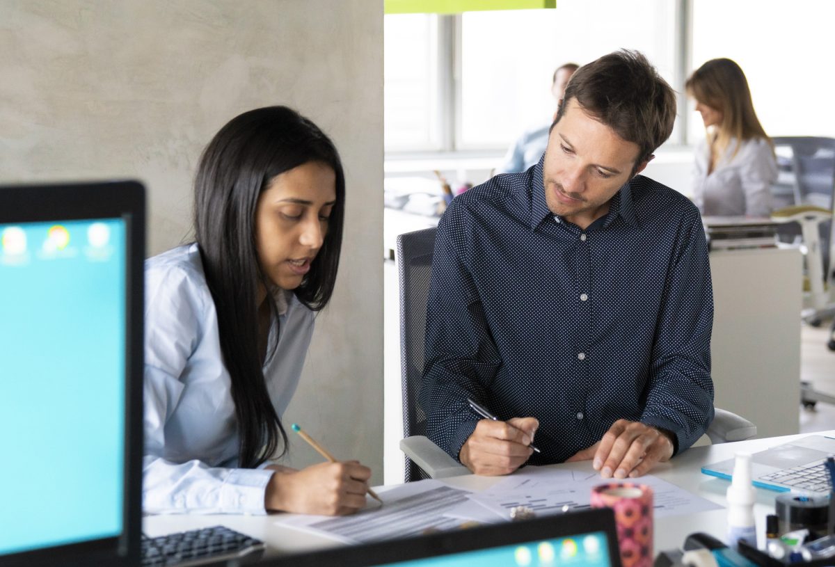 Business colleagues analyzing financial reports