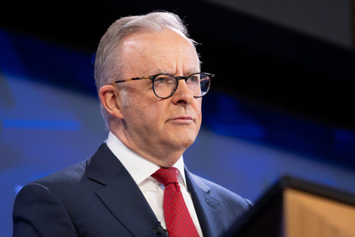 man at lectern
