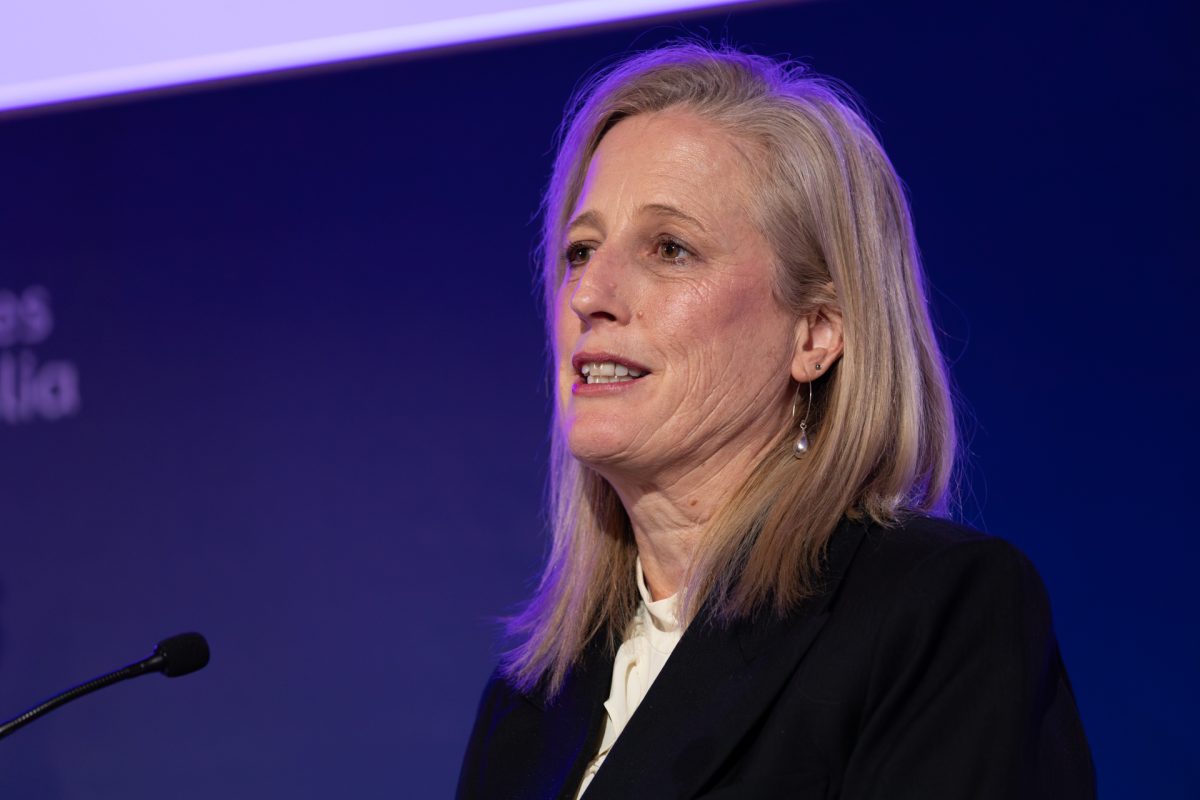 A woman speaking at a lectern