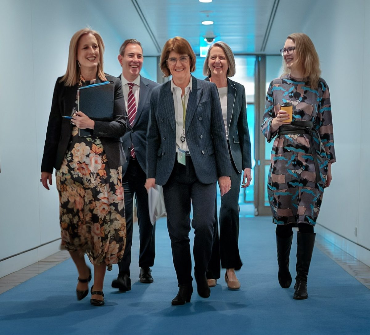 people walking in a corridor