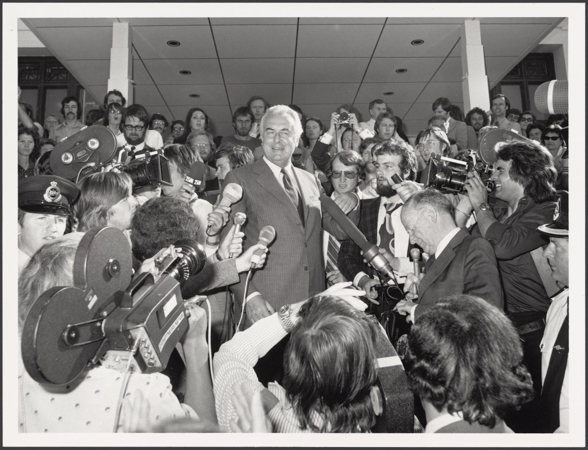 Black and white photograph with a crowd of people