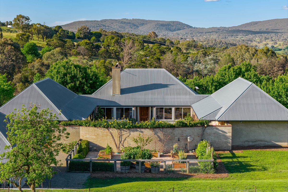 front of country home with walled courtyard and kitchen garden