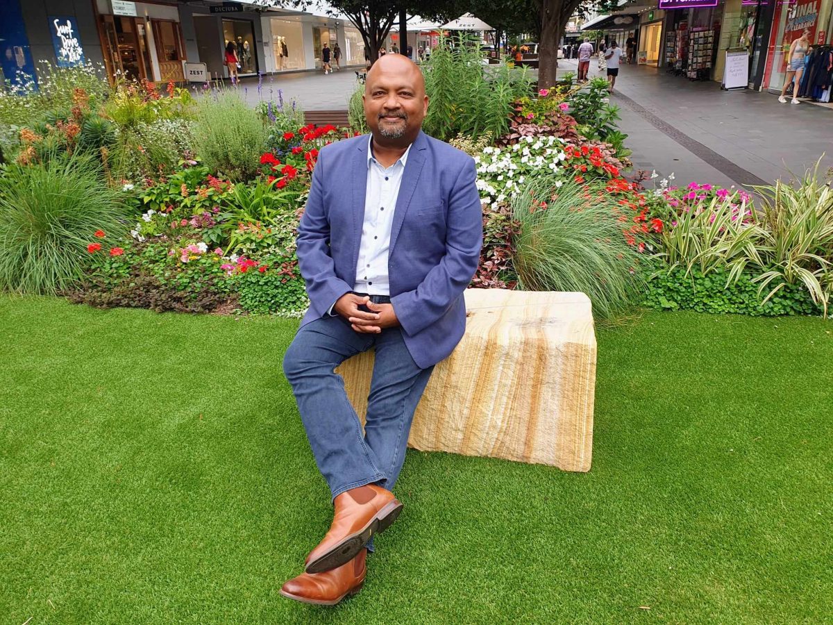 Henry Rajendra sits in Wollongong's Crown Street Mall.
