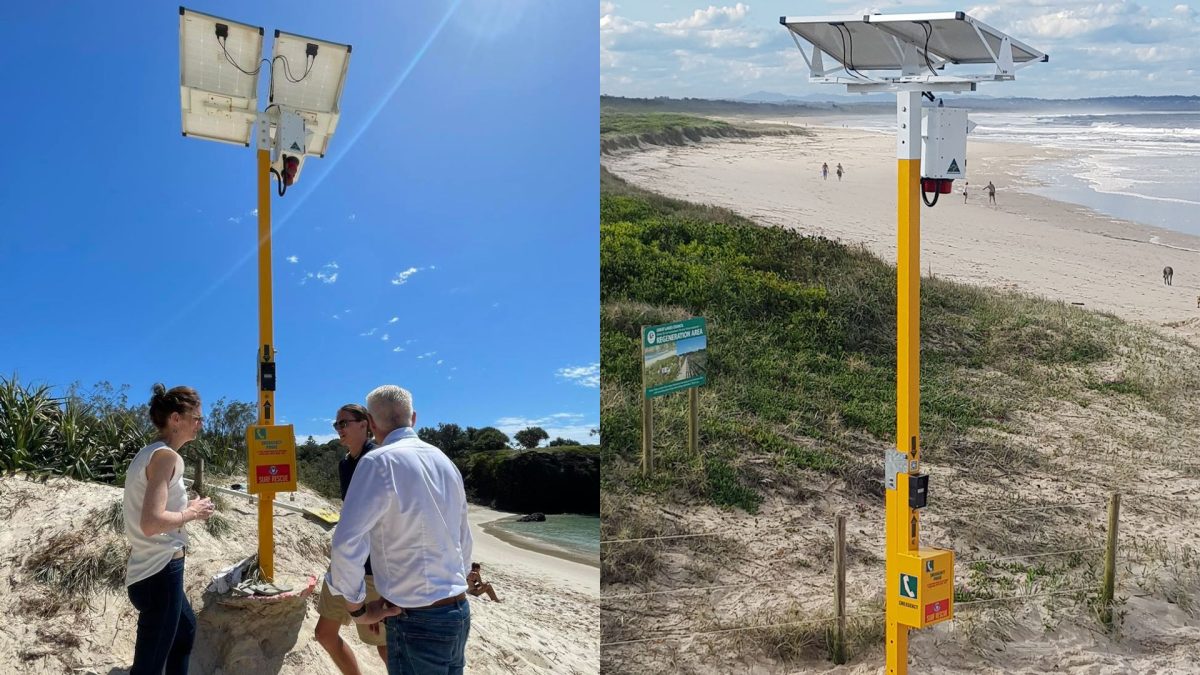 People at an emergency rescue beacon on a beach.