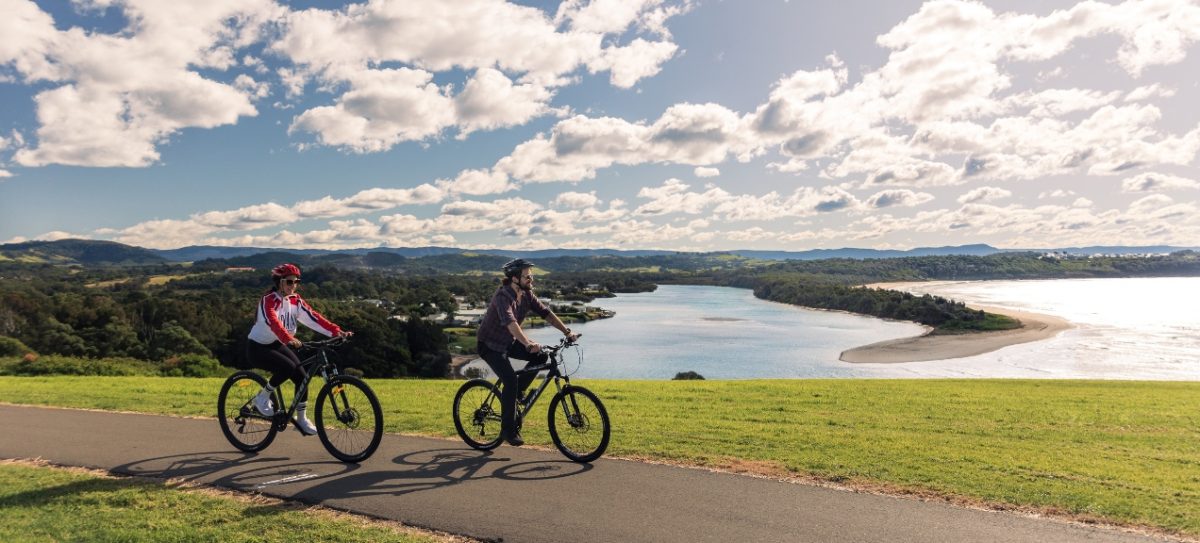 Two people on pushbikes.