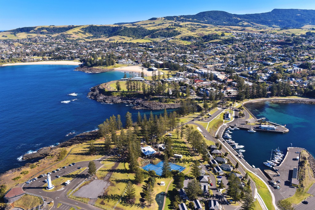 Aerial photo of KIama harbour and town.