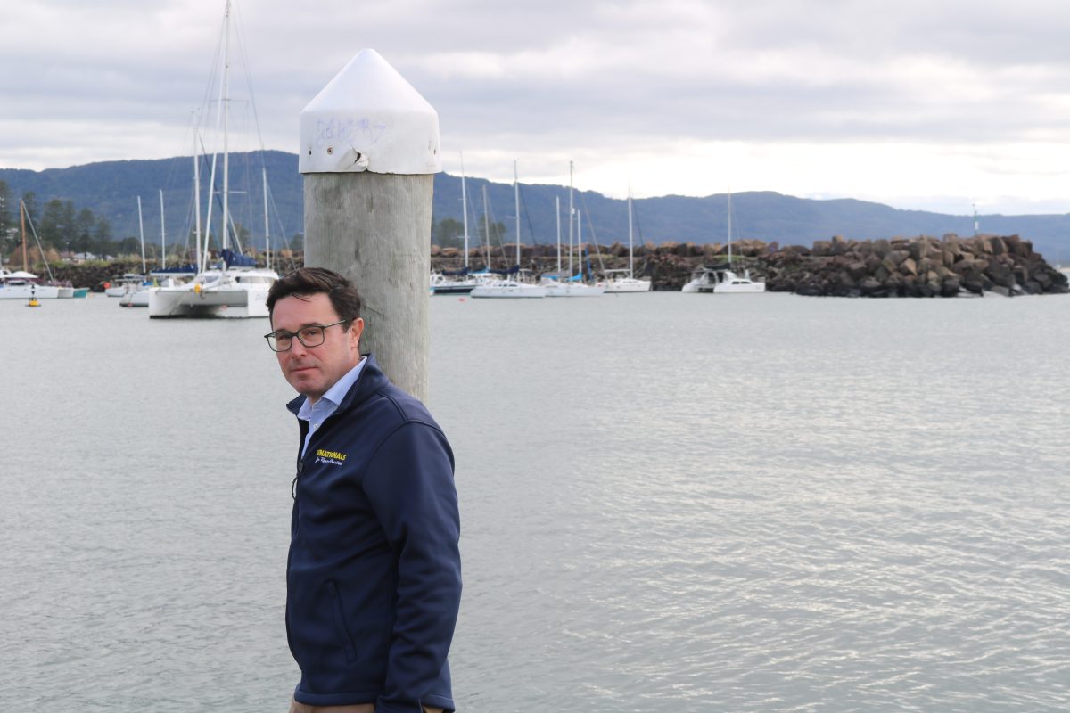 Man standing in front of boats