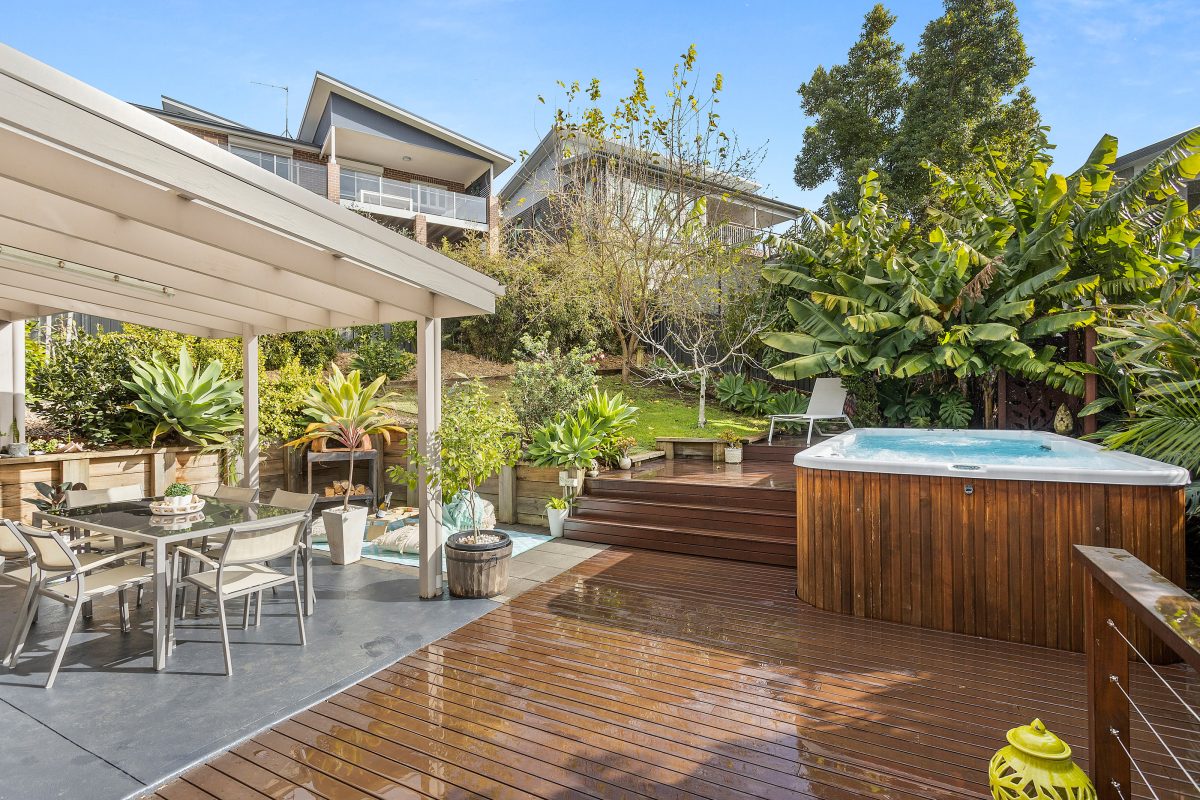 Outdoor entertaining space with spa pool at 38 Banksia Drive in Kiama