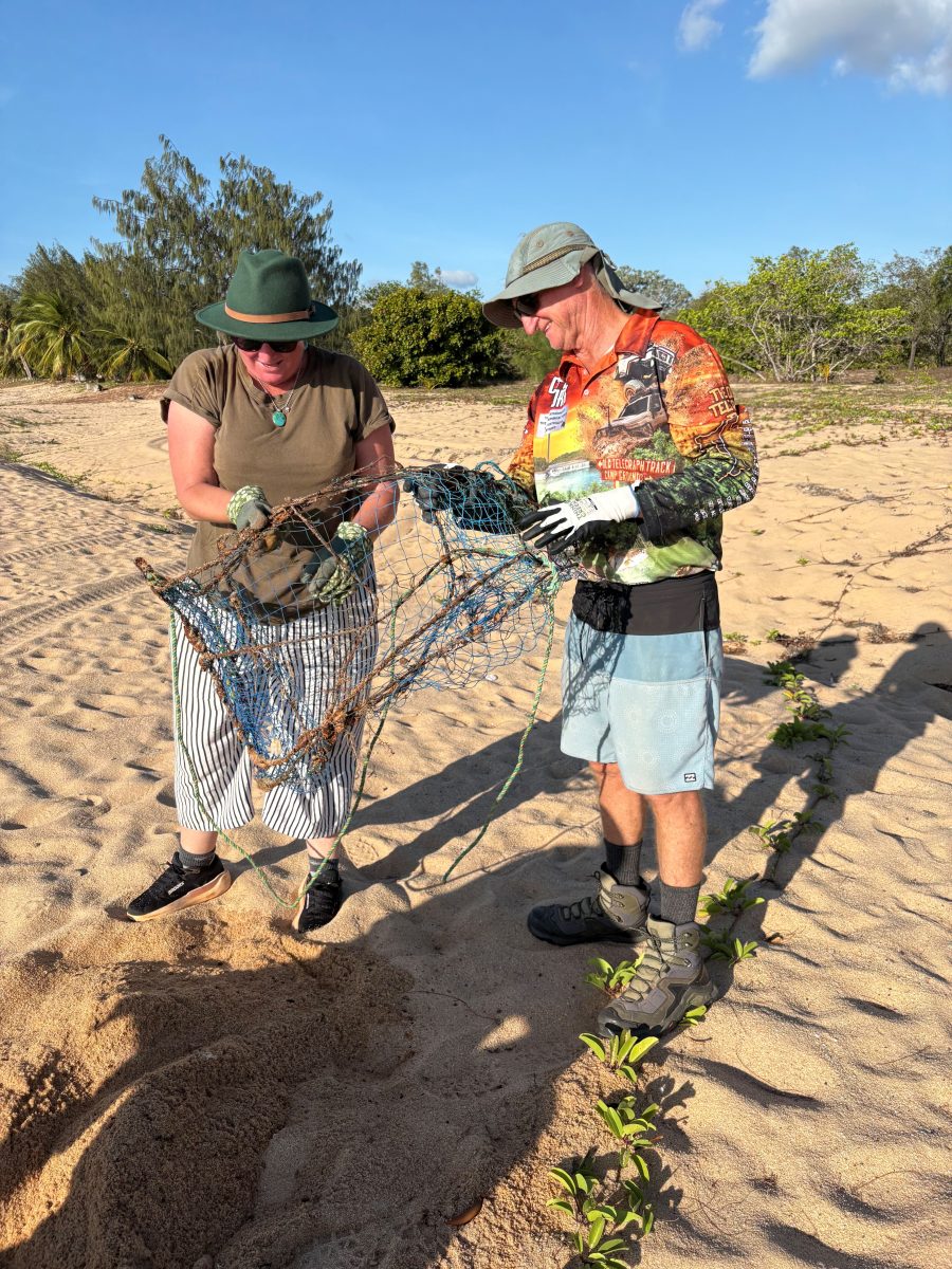 Seisia clean-up members find an old discarded crab pot