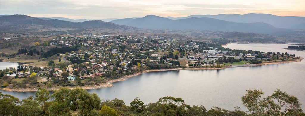 Aerial shot of regional town and its surrounding lake