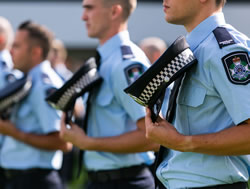 Police recruits line up for graduation