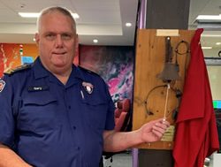 Paramedic Garry tucks his hat away