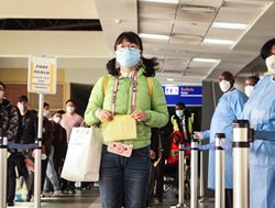 Airport COVID cases prompt call for masks