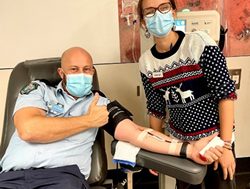 Police bleeding to win blood challenge