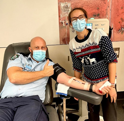 Police bleeding to win blood challenge