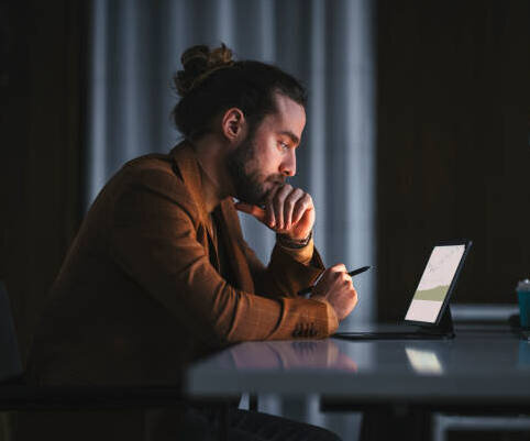 A man using a laptop at a table