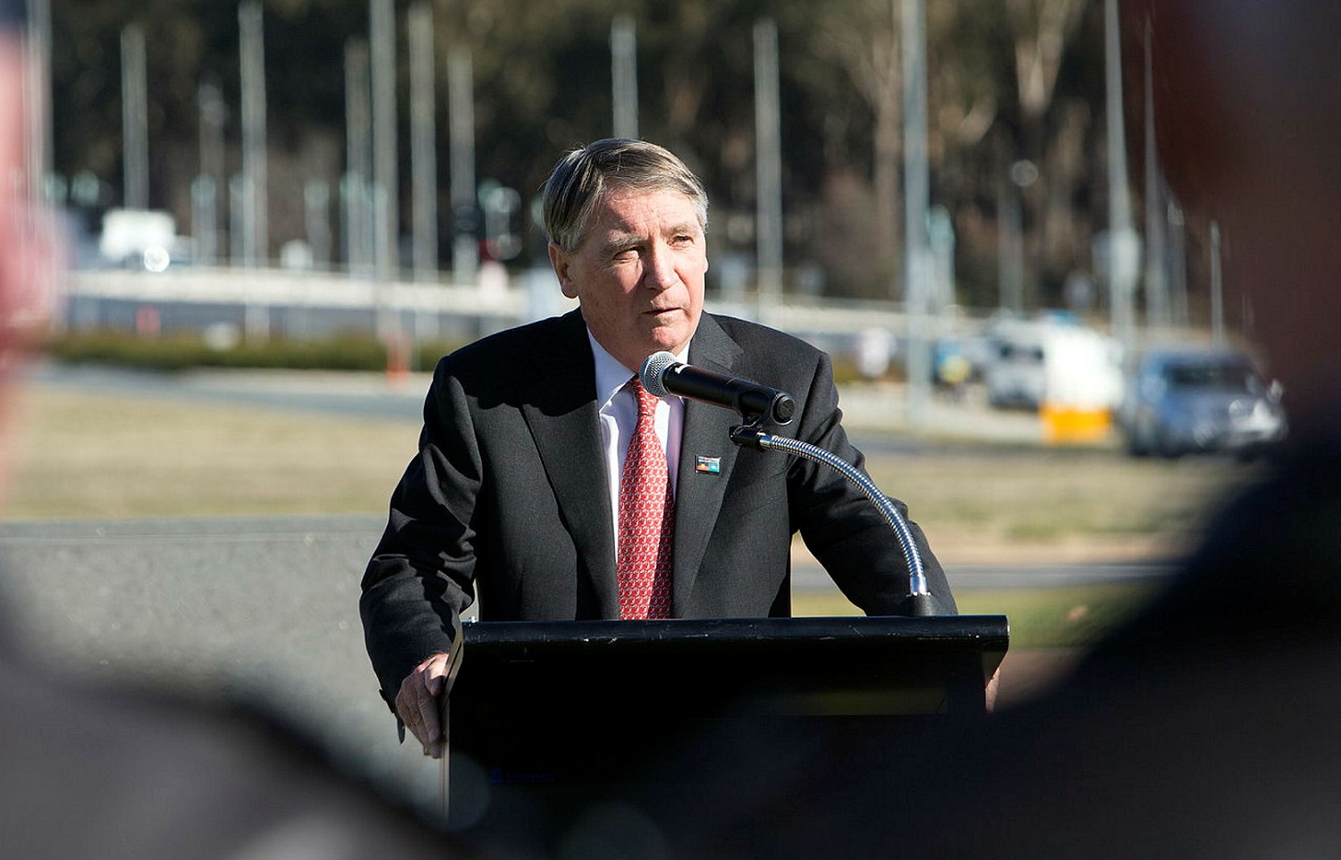 man speaking at lectern