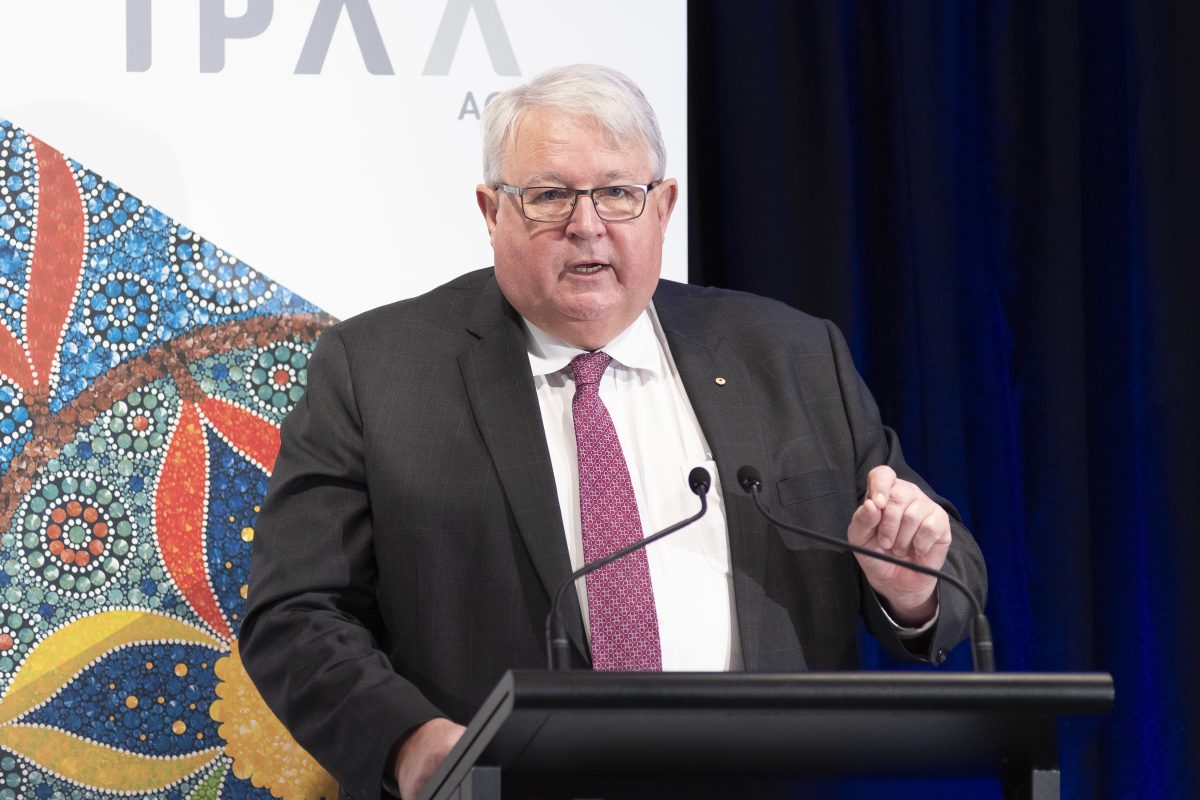 Man speaking from a lectern