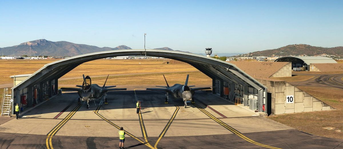 planes under a shelter at an air force base