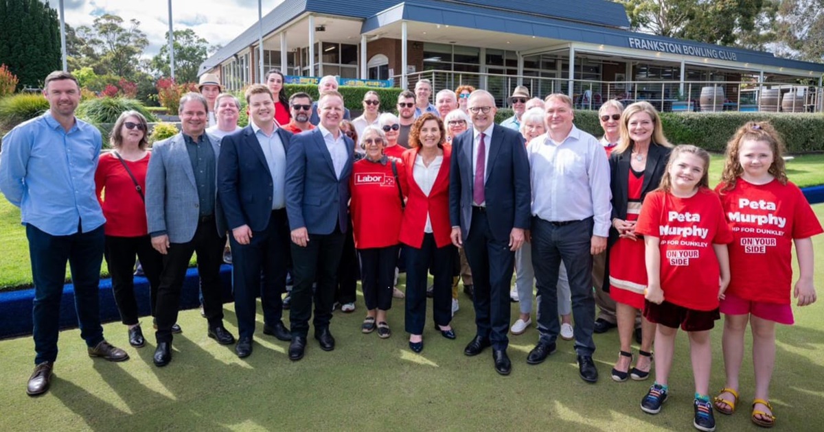Candidate Jodie Belyea with PM and other supporters at a bowls club