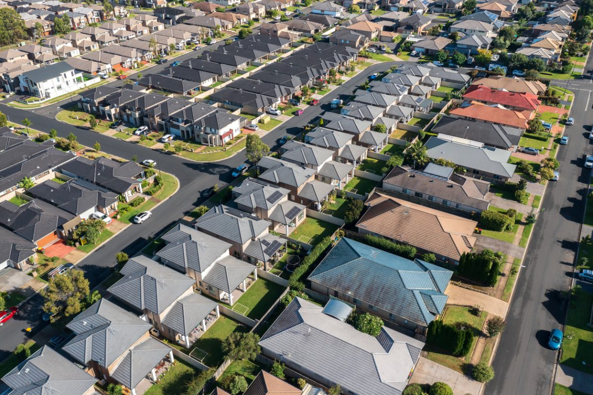 Aerial view of rows of mass produced 'cookie cutter' style homes built during the 2010s in outer suburban Sydney, Australia.
