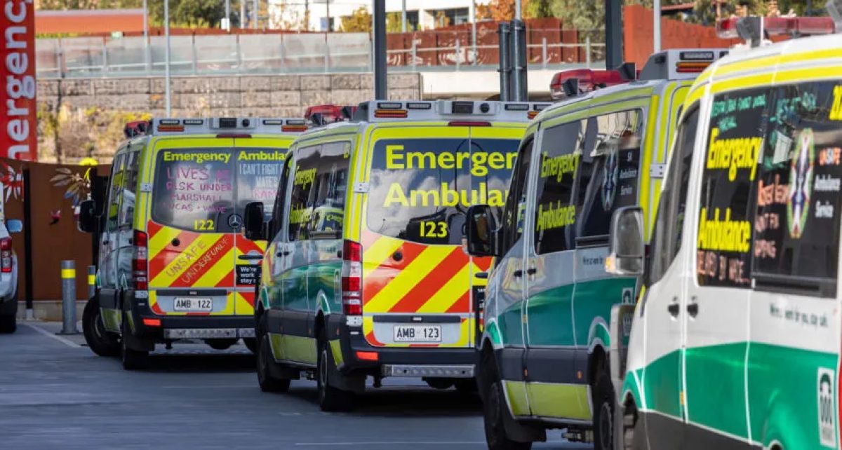 Multiple ambulance vehicles queuing for the emergency department.