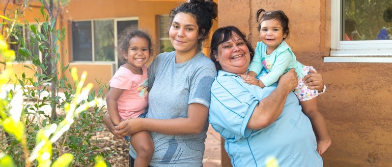 An Indigenous family of women and toddlers in the Northern Territory