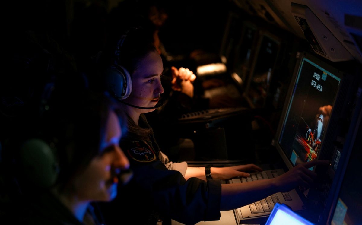 air force console operators monitoring radar and other systems