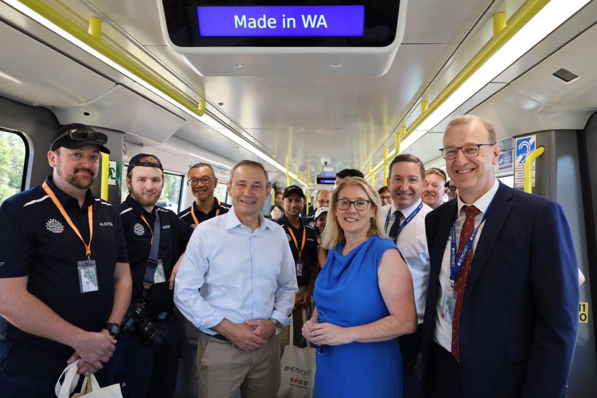 WA Premier and Transport Minister standing with rail workers on the new METRONET train.