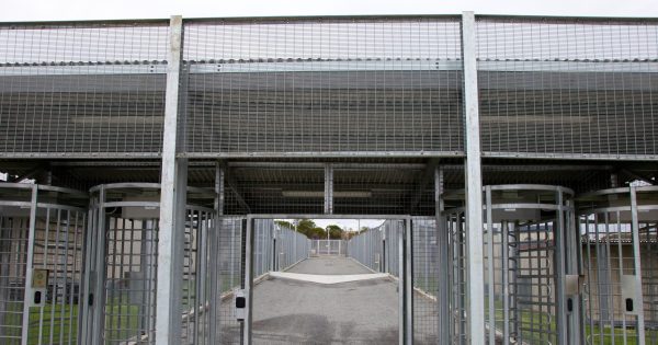 Home Affairs rejects commission's detention centre recommendations