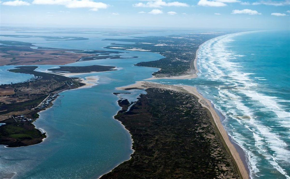 aerial view of a river mouth and coastline