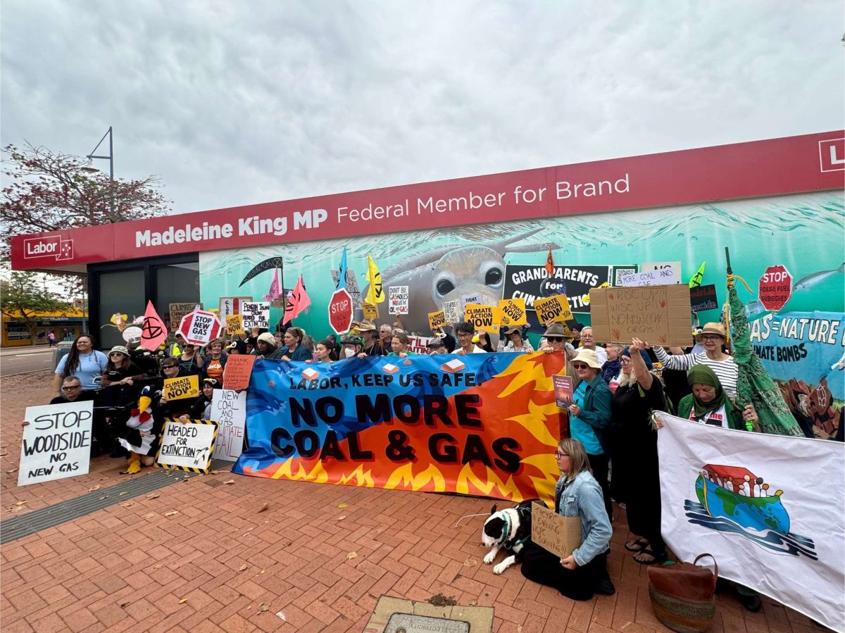 climate activists protesting outside an electorate office