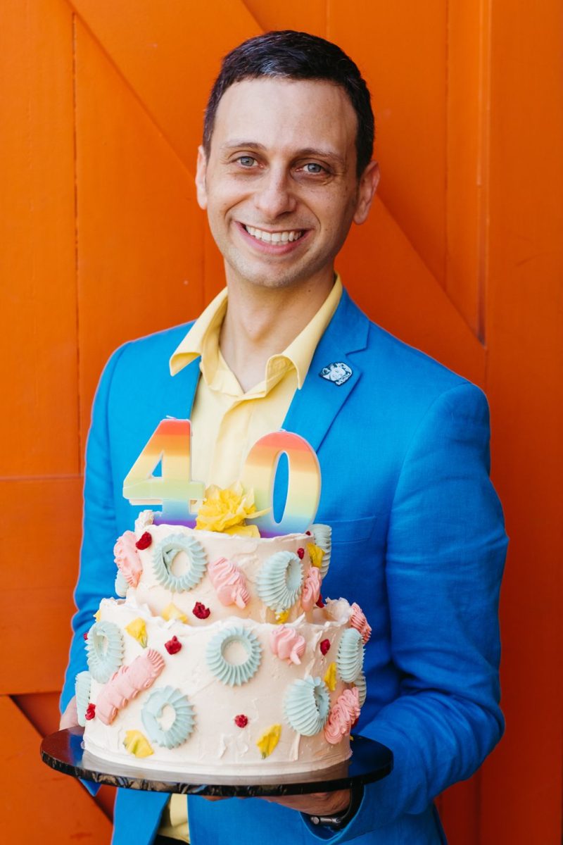 smiling man with cake
