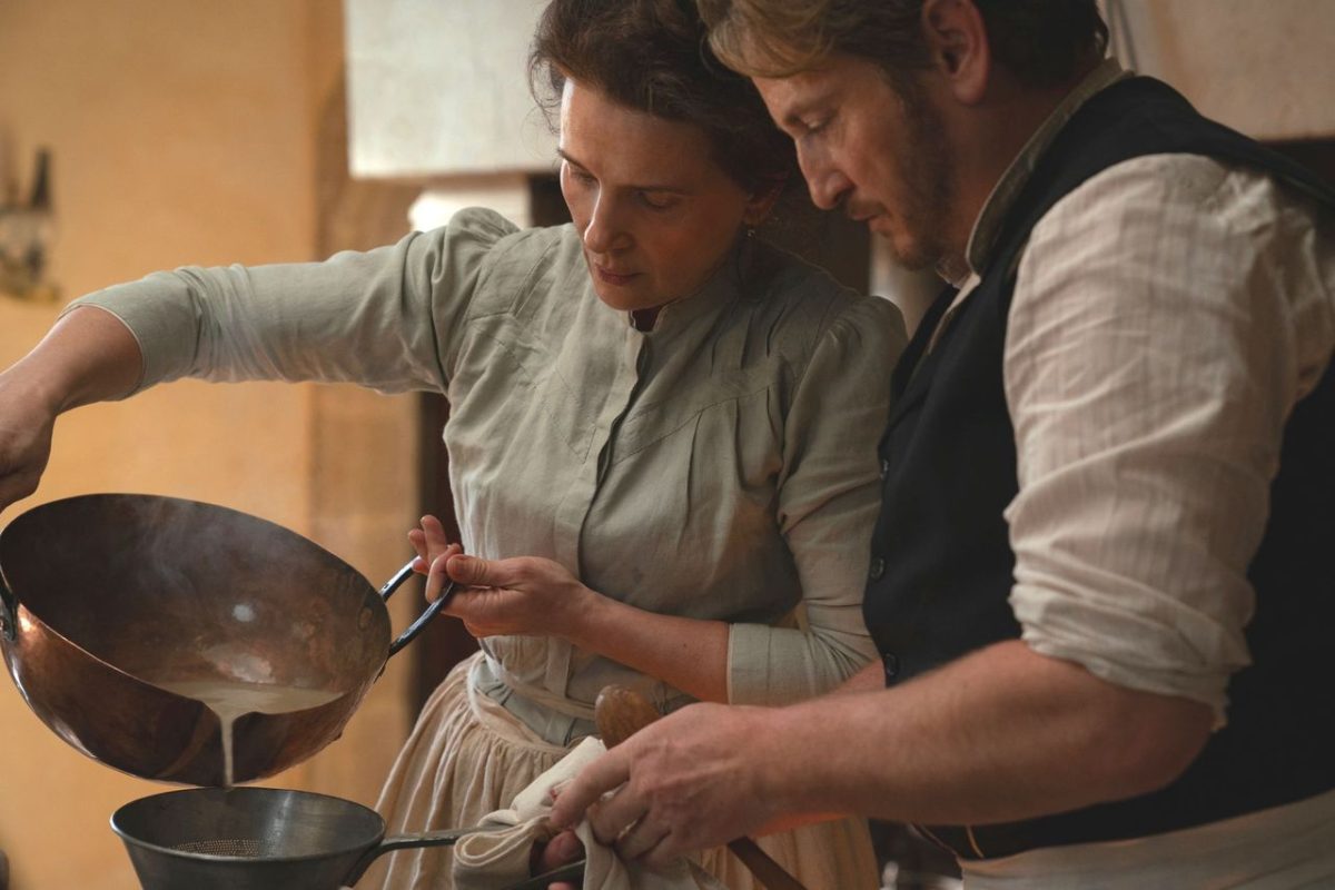 movie still of a woman and a man cooking